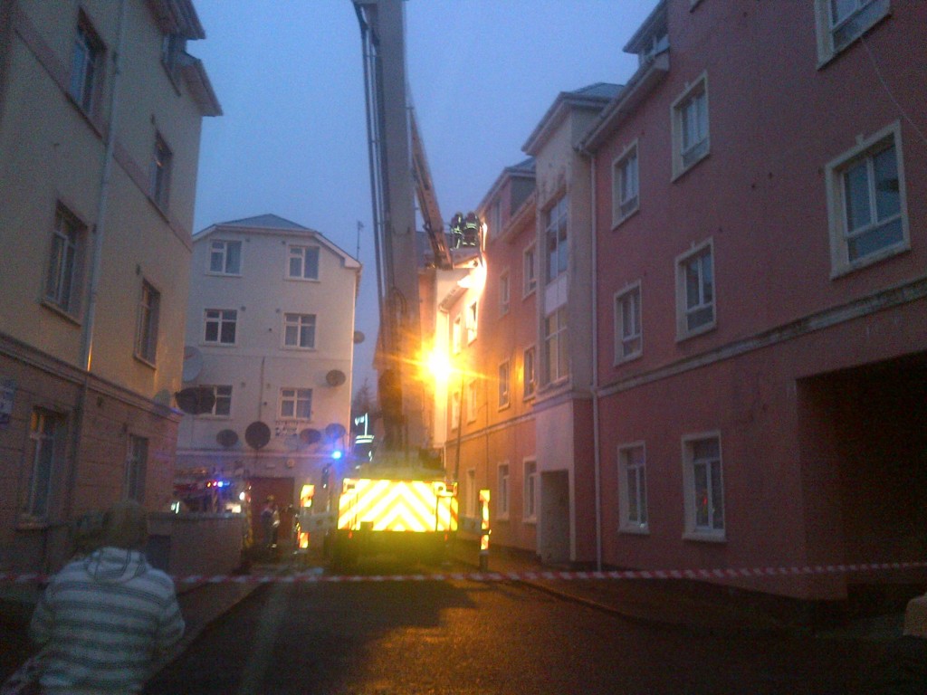 Firemen attempt to take the couple from the apartment. Picture copyright Donegal Daily. 