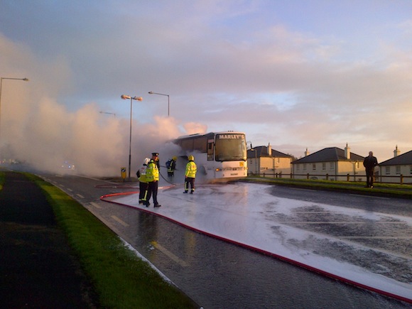 Gardai and the fire service at the scene of the bus fire. Pic by Donegal Daily.