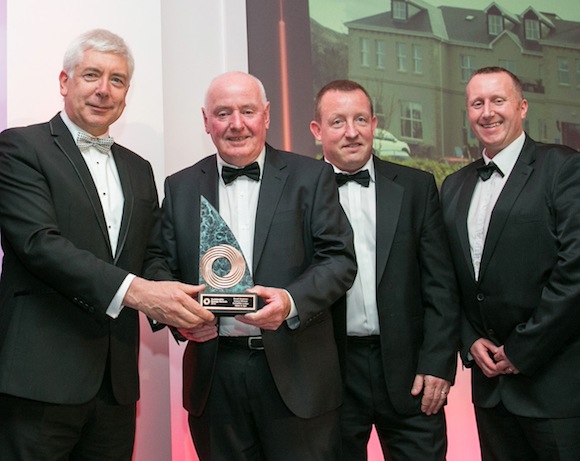 Alex White T.D. Minister for Communications, Energy and Natural Resources presenting the SEAI award to Colm O’Kane (Ballyliffin Loudge Hotel and Spa) with  Neil McDaid and Noel McGonigle (Daigon Ltd) who helped to deliver the project.