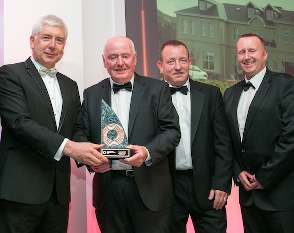 Alex White T.D. Minister for Communications, Energy and Natural Resources presenting the SEAI award to Colm O’Kane (Ballyliffin Loudge Hotel and Spa) with Neil McDaid and Noel McGonigle (Daigon Ltd) who helped to deliver the project.