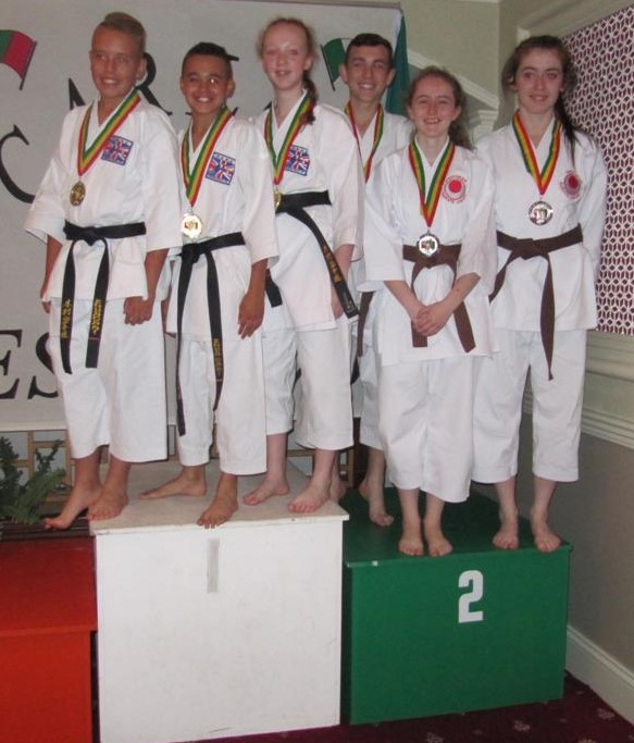 Stephen-John Carlin, Isobel Walsh and Laura Browne with silvers for team kata