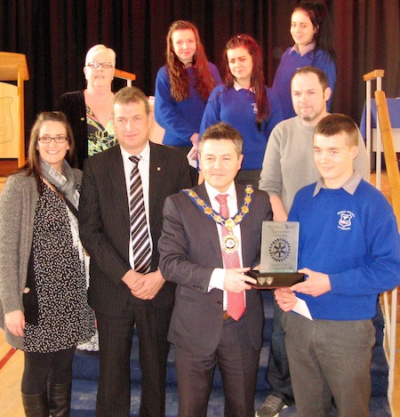 mayor of Limavady Alan Robinson, presenting Niall O' Donnell with the winning trophy. Also included in the photo back row, Mary McCloskey, principal of St Mary's High School, Limavady. Front row, left, teacher Ms McLaughlin and middle row right teacher Mr Sweeney, Errigal College. 