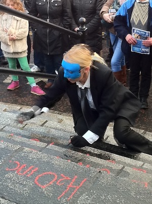 The writing is on the wall for the Government according to this protestor. Pic Donegal Daily. 