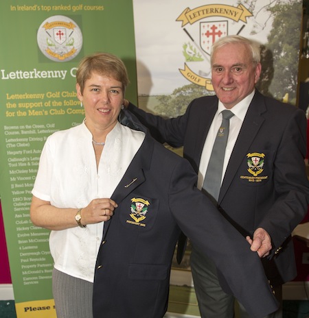 Outgoing President Barry Ramsay congratulating  Anne Condon  on her history making appointment as Letterkenny Golf Club President 2015. Barry helping Anne with her President's blazer. 