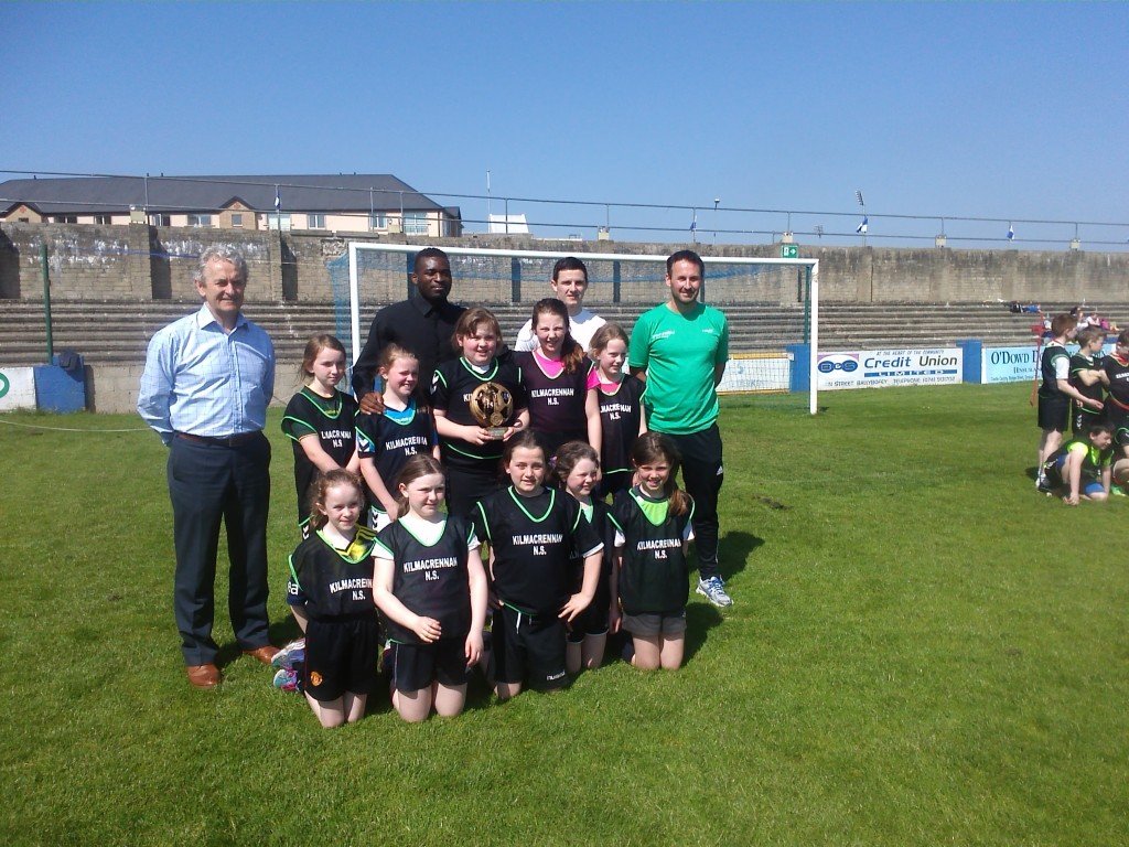 Winning girls & boys team along with Paddy Harte (chairman); Mel O'Donnell (teacher); Wilfred Tsgabo & Ciaran Coll (Finn Harps Players)