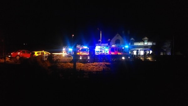 Members of the Gardai and the Fire Service at the scene of the Christmas morning's fire at Larkins of Newmills.