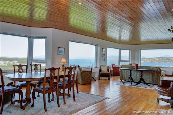 Imagine watching the sun go down or come up from this room with panoramic views!