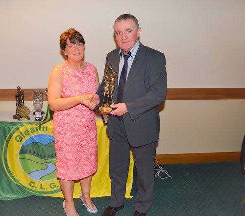 Marie Boyle receives Senior Ladies Player of the Year Award from Hugh Mc Daid at the Station House, Letterkenny.