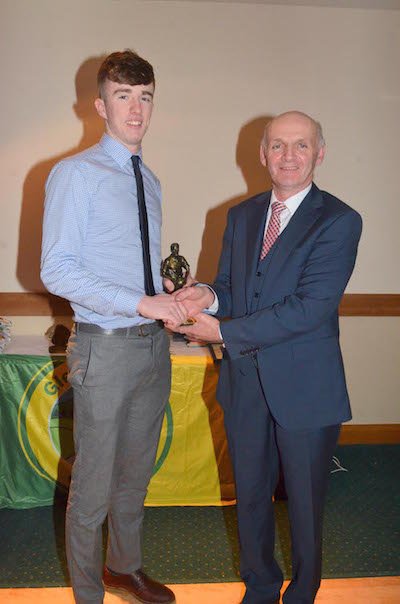 Caomhin Marley receives Young Player of the Year from Rodger Mc Daid, sposnsored by Rodger Mc Daid Tyres, at the Glenswilly Presentation Dinner Dance held in the Station House.
