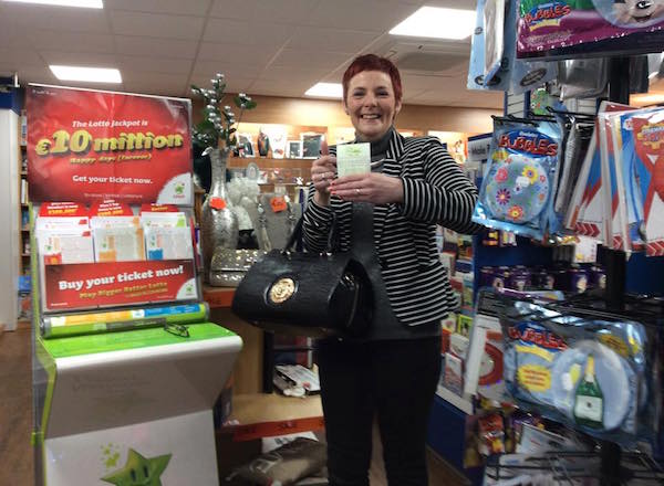 Sweet News shop assistant Brid Coogan celebrates after the shop sold a €500,000 winning Euromillions ticket.