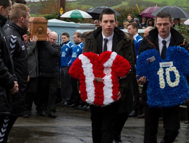 Floral tributes which represent the two clubs he played for with so much distinction Derry City FC and Glenavon FC. 