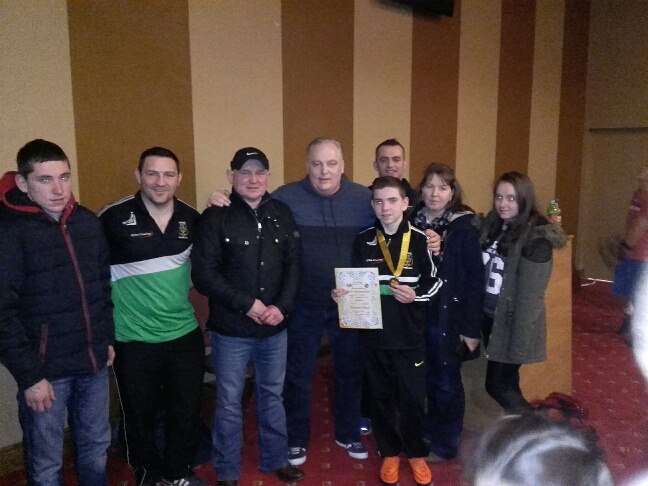 The proud Crawford family with their newly crowned 42kg Ulster Champion son Liam and Cllr Frank Mc Brearty . Also pictured Raphoe B.C. coaches Gary McCullagh & Gerard Keaveny.