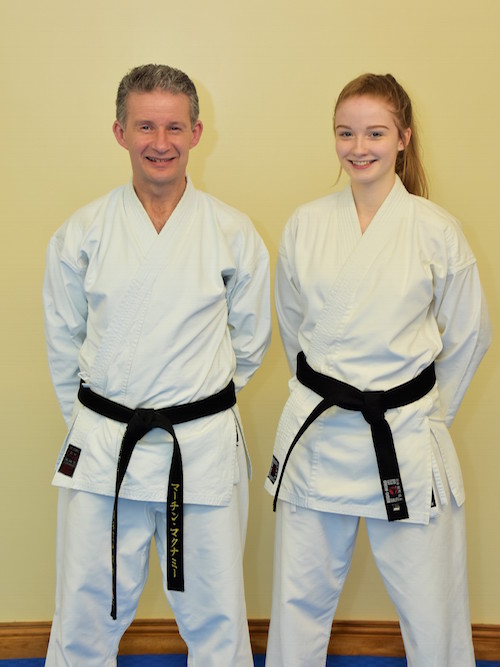 Head Coach of the Three Rivers Martin McNamee Sensei standing proudly alongside Sara Martin Sensei after receiving her black belt. Image by Máirtín Mac Crábhagáin***