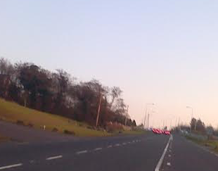Cars wait to be diverted past the collision at Mountain Top