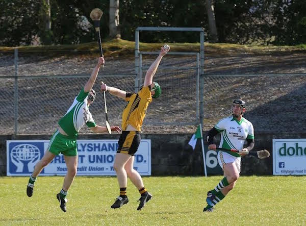 Eugene Organ fields a high ball, with Thomas Gillespie and Kevin Kenny competing