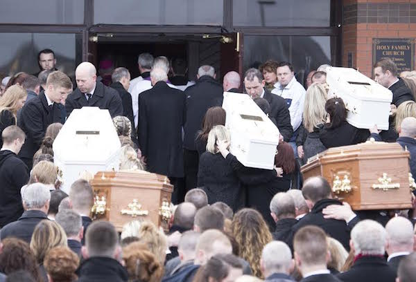 the remains of the five tragic family members are carried into the Holy Famoily Church for Funeral service. (North West Newspix)