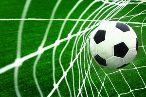 635854883677322529-331387917_soccer-football-ball-in-goal-net-o
