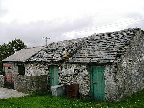 A stone slate-roofed barn in County Donegal before and after it benefitted from the Traditional Farm Buildings Grant Scheme administered by The Heritage Council.