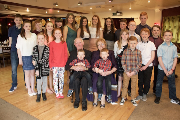 John and Betty Harkin with their 21 grandchildren on the occasion of their 50th wedding anniversary.