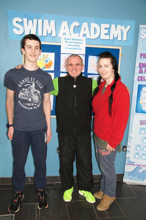 Jane Boyd and her son Isaac who will swim a mile this week as they attempt to raise funds for the oncology unit at Our Lady of Lourdes Hospital in Drogheda, where Jane’s sister Eimear passed away recently. They are pictured with Terry McCauley, duty manager at the Aura Leisure Centre, Letterkenny where they trained for the swim.