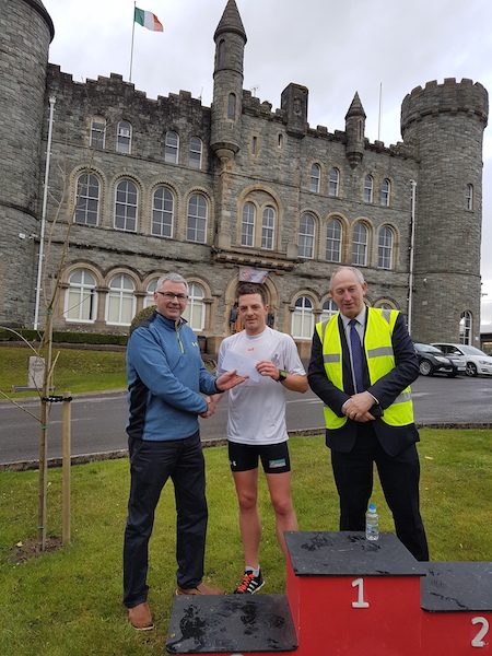 Gordon Randles of Letterkenny Credit Union with winner Danny Mooney and Chris Darby, principal of St Eunans College.