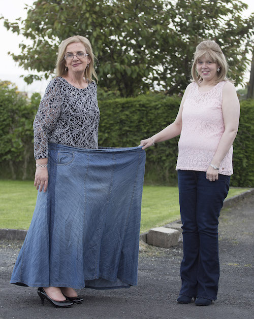 Inspirational Geraldine Glenn who has lost 13st 11Ibs, holding one of her skirts with the help of her daughter, Carol, who has also lost 4st 7Ibs, which she was wearing just under 2 yrs ago . (North West Newspix)