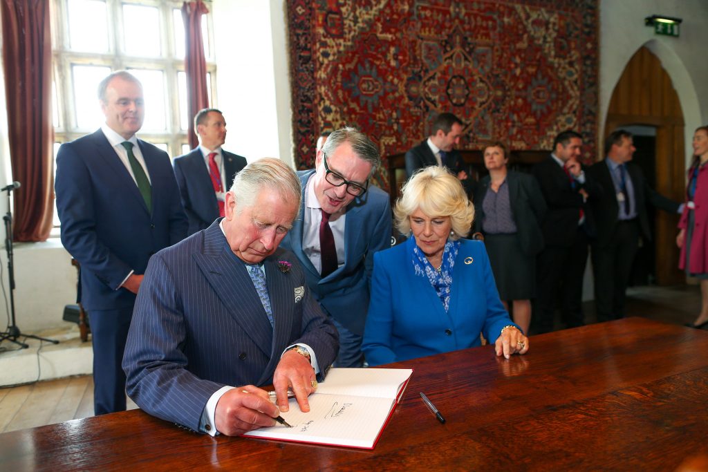 25/05/2016 NO REPRO FEE, MAXWELLS DUBLIN, IRELAND Visit to Ireland by The Prince of Wales and the Duchess of Cornwall. Donegal, Ireland. Pic Shows: HRH The Prince of Wales and the Duchess of Cornwall signing the guestbook at Donegal Castle. PIC: NO FEE, MAXWELLPHOTOGRAPHY.IE