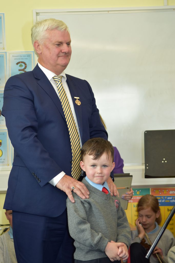 Young Joseph Duddy with Aogan O Fearghail, Uachtaran Chumann Luthchleas Gael at the opening of the New Astro Pitch at Scoil Strath Mor.