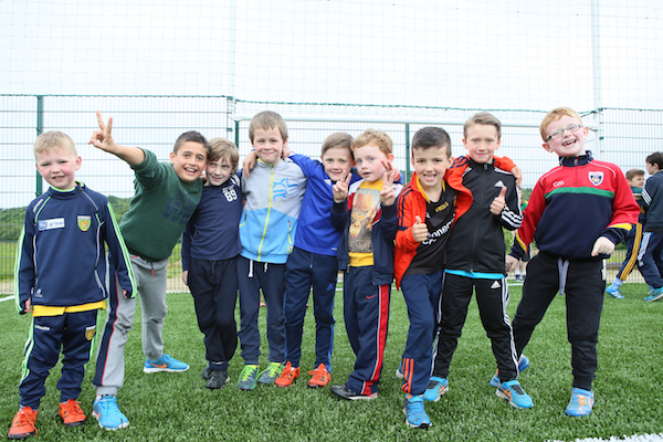 Students celebrating on the new pitch at Glenswilly National School.