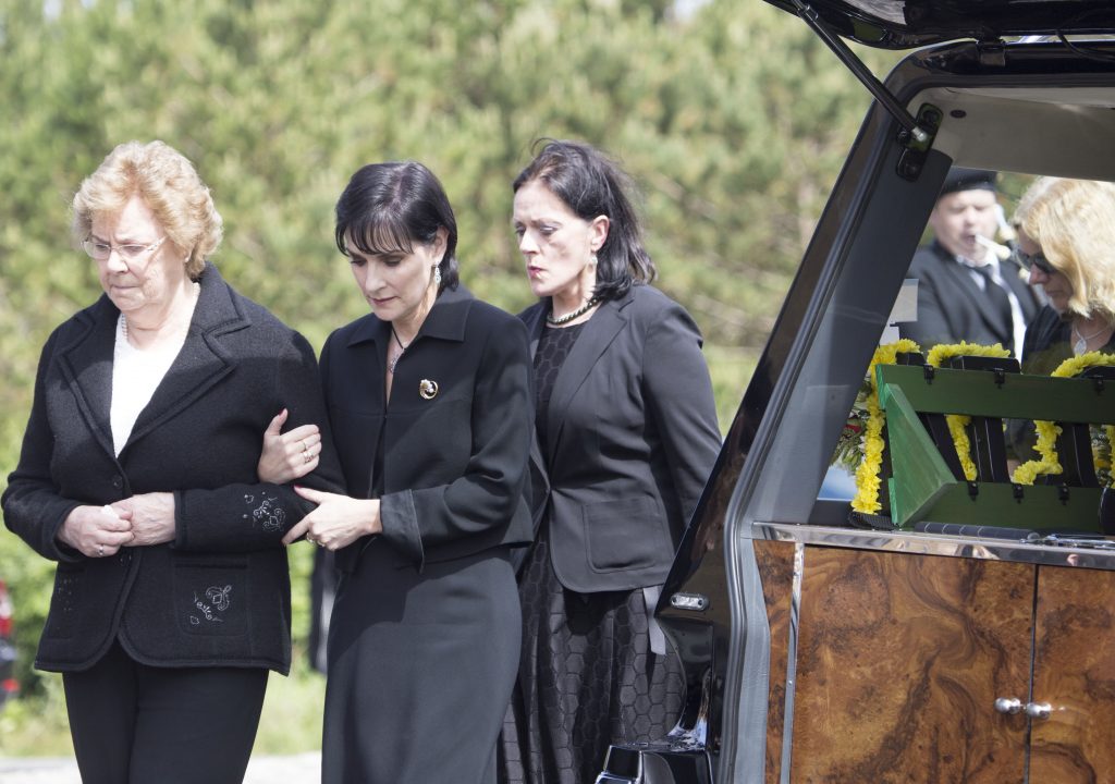 Enya with her mum Baba and sister Olive at the funeral of her late father Leo at St Mary's Chapel, Derrybeg. (North West Newspix)