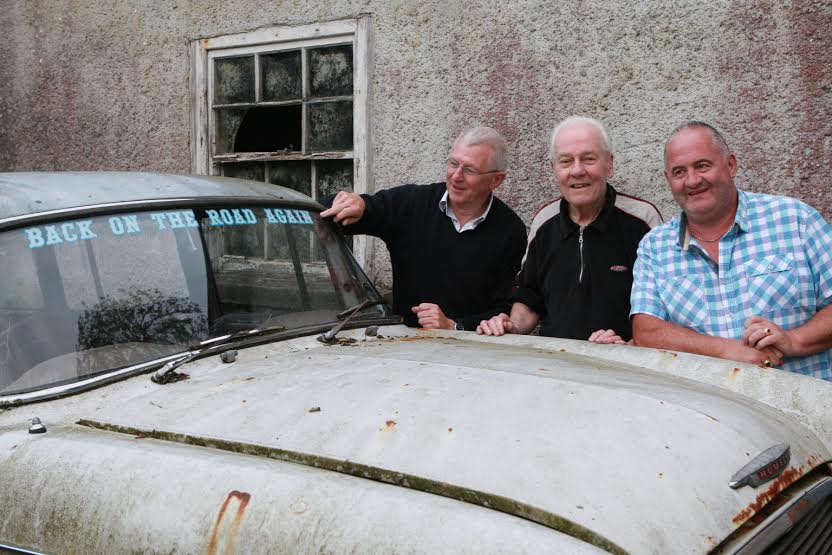 Back on the road again. James Cullen with Micky Gallagher at the windscreen of one of his Humber Halks pictured with Denis Orr as James get ready to compete in this year's Donegal Rally. Photo Brian McDaid