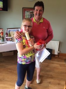 Mia McClintock receiving her Appreciation Certificate from Lady Captain Mary Lafferty