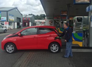 Brendan, our friendly petrol pump attendant keeps a straight face as he fuels up our badly parked Toyota Aygo at Tobin's filling station. Photo Brian McDaid