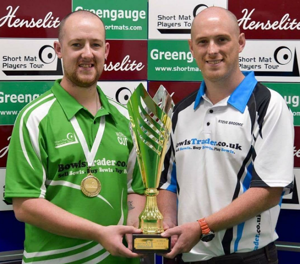Captain PJ Gallagher being presented with the World Cup by Steven Broome