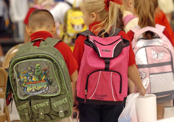 children with backpacks