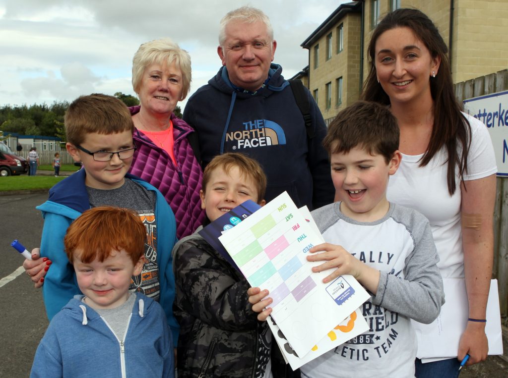 Joshua and Eathan Duffy with their grandmother Bridie O'Kane with Colm, Caobhan and Paul Hegarty who received their Boad Gis wall planners and calendars from  Lucy from Real Nation at  Letterkenny Educate Together  National School.  Photo Brian McDaid