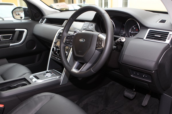 A view on the leather interior of the Land Rover Discovery Sport complete with its switch for a gear stick on the automatic box. Photo Brian McDaid