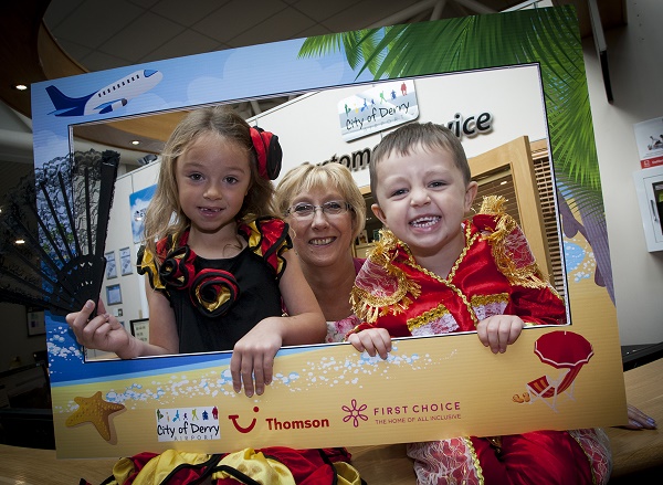 The Mayor of Derry City and Strabane District Council, Alderman HIllary McClintock pictured at City of Derry Airport on Thursday for the launch of Thomson's new City of Derry to Majorca route. Included are local children Leyton (4) and Amaira (6) Shongo.