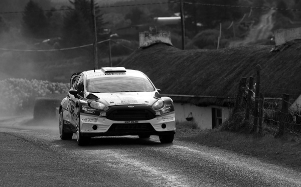 Winner of the Harvest Rally, Declan and Brian Boyle pictured as they power past the 300 year cottage of the Gallagher family on Saturday photo Brian McDaid