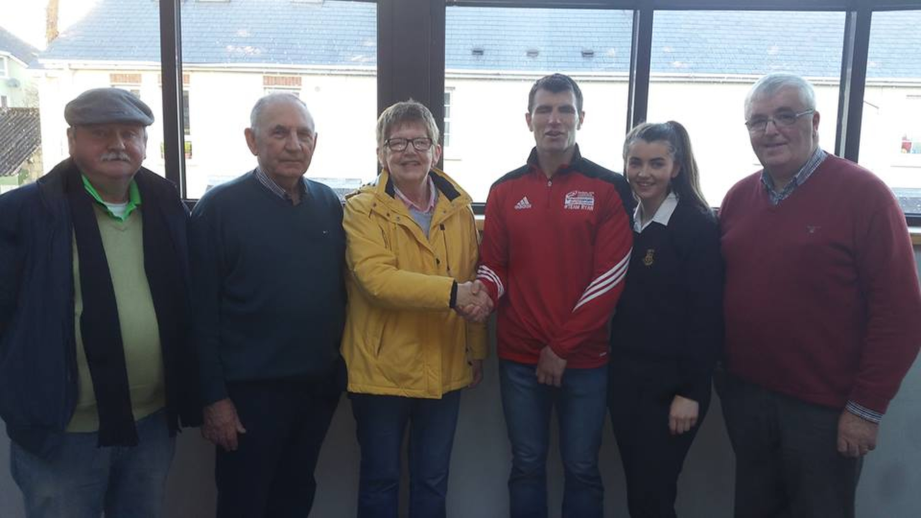 Ita Daly who was the lucky winner in the Letterkenny Credit Union Draw. pictured as she is congratulated by Danny Ryan who made the presentation pictured with members of the Letterkenny Credit Union board.