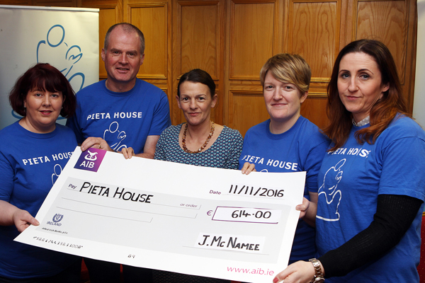 Julie McNamee makes a presentation of Û614. 00 to Pieta House, proceeds from her run in the Dublin City Marathon. Receiving the cheque are from left , Anastasia Rouche , Danny Devlin, Donna Campbell and Paula Coyle: Photo Brian McDaid
