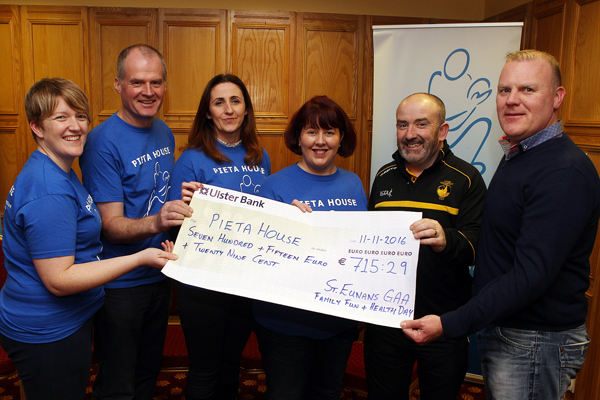 Alan O'Connell and Eugene Duffy make a presentation on behalf of St Eunan's GAA Club of Û715.29 from their recent family fun day to Pieta House. Represented by (from left) Donna Campbell Danny Devlin Paula Coyle and Anastasia Rouche . Photo Brian McDaid