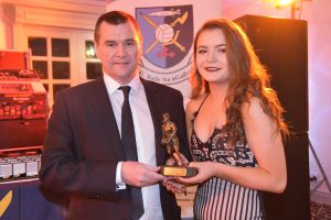 Donegal Chairman Sean Dunnion presents Niamh Gallagher with Milfords Senior Ladies Player of the Year.