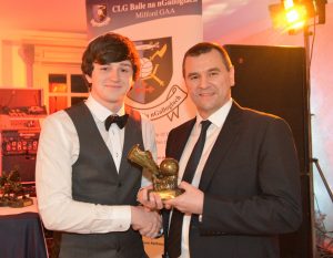 Milford's Gavin Grier receives the U21 player of the year from Donegal County Chairman Sean Dunnion at Mulroy Woods.