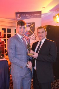 Milford's Reserve player of the year Caolan Bolton with Donegal Chairman Sean Dunnion.