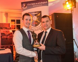 Donegal Chairman Sean Dunnion presents Cathal Mc Getitigan with Senior Player of the Year Award at the Milford presentation at Mulroy woods.
