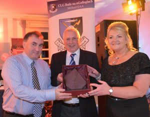 Milford Chairman Pat Curley presents Aodh and Roisin Mc Cormick with Club Persons of the Year Award at the Mulroy Woods Hotel.