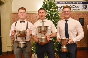 Milford's Kane, Shaun Paul and Luke Barrett with the League Cups and Minor Championship Cup at the Clubs Presentation night at Mulroy Woods.