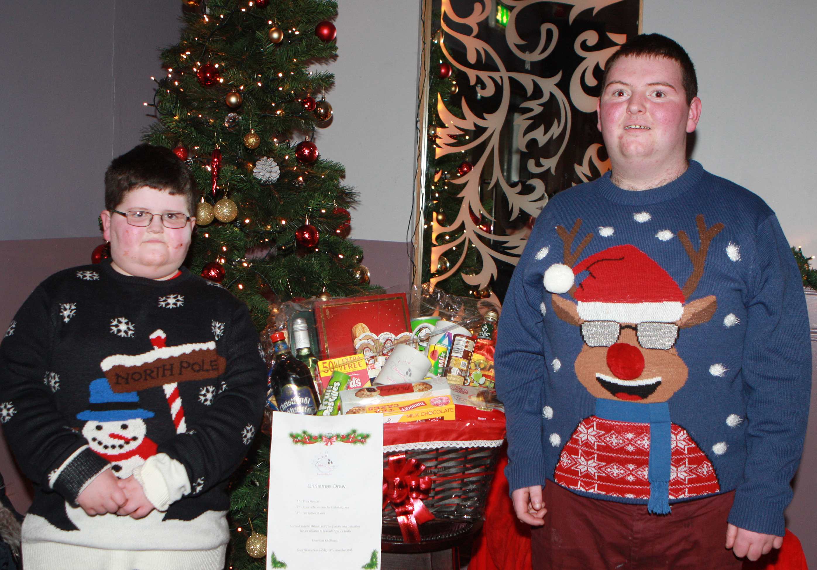 Jamie and Galen McColgan winning a Hamper 1st prize in the LK Strikers Christmas raffle