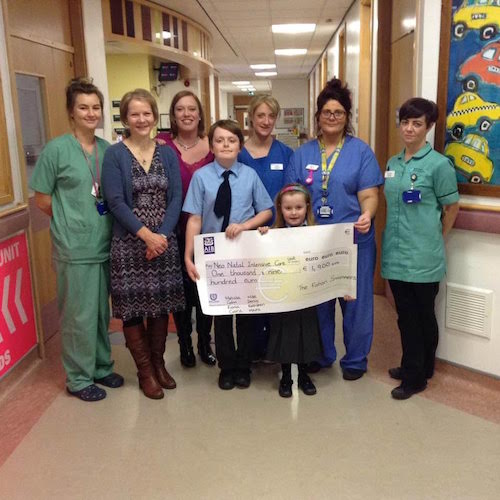 Pictured presenting a cheque for €1,900 to the nurses at the Neo Natal Intensive Care Unit in Altnagelvin Hospital are Fiona Kerr representing Fahan Swimmers 2nd from left, Kathleen McGinley, 3rd from left and her children Dara and Leah McLaughlin, both of whom spent the first two months of their lives at Neo Natal Intensive Care Unit in Altnagelvin Hospital.